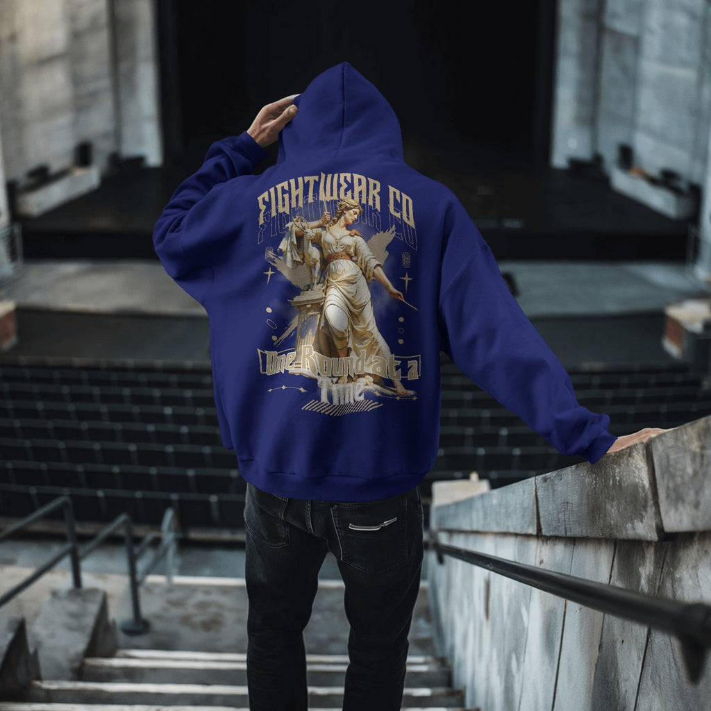 gritty-cityscape-hoodie-mockup-male-model-with-haunting-horror-design-in-dystopian-backdrop-0346