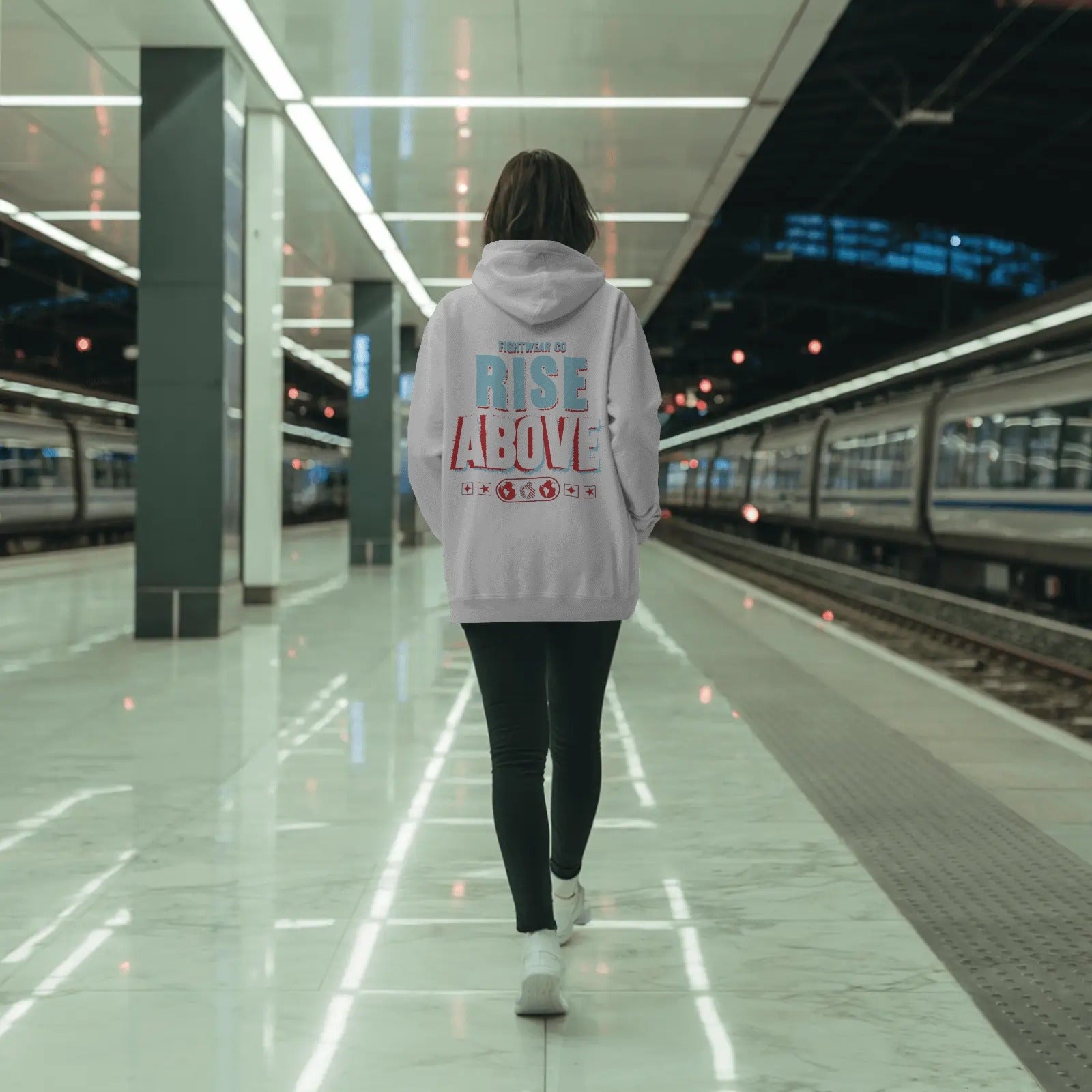 hoodie-mockup-on-woman-walking-in-subway-terminal-with-bright-lights-and-minimalist-urban-look-0786