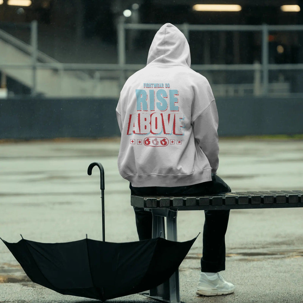 rainy-day-hoodie-mockup-person-sitting-on-metal-bench-with-open-umbrella-moody-outdoor-setting-0789